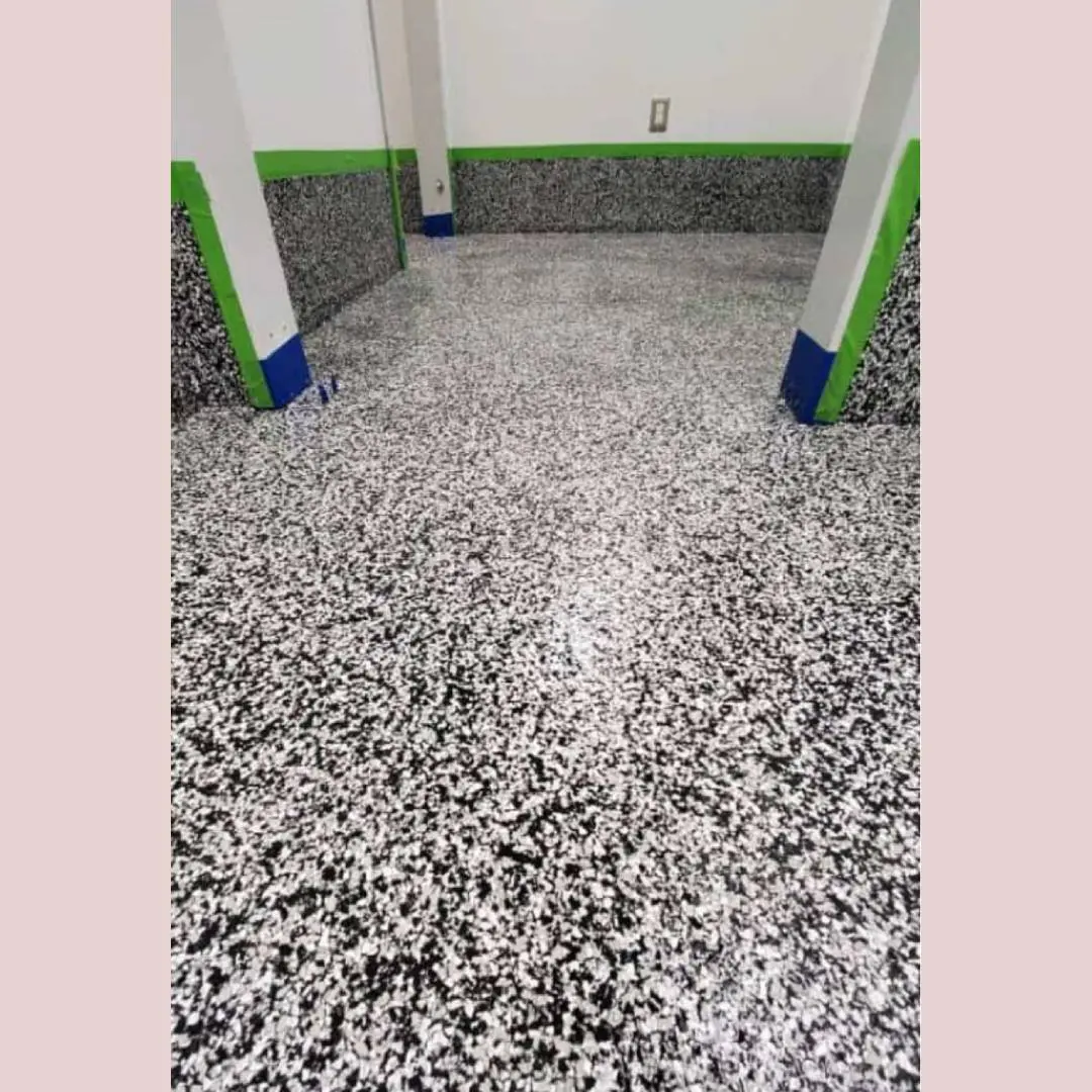 A room with a floor that has been painted black and white.