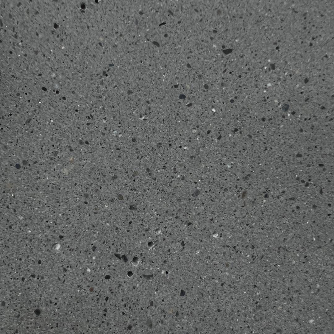 A close up of the surface of a concrete floor