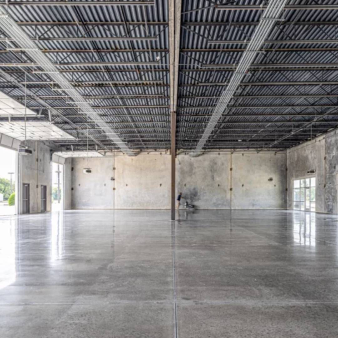 A large empty room with a ceiling and walls.